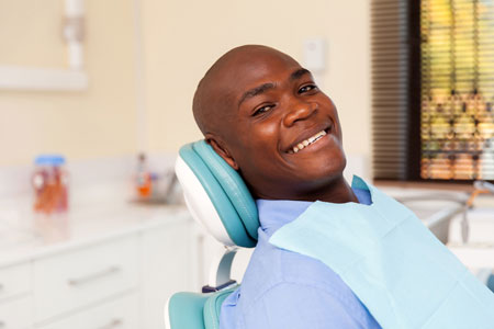 Man Smiling After Tooth Extraction