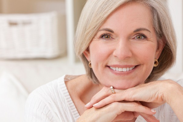 Woman with Implant Supported Dentures